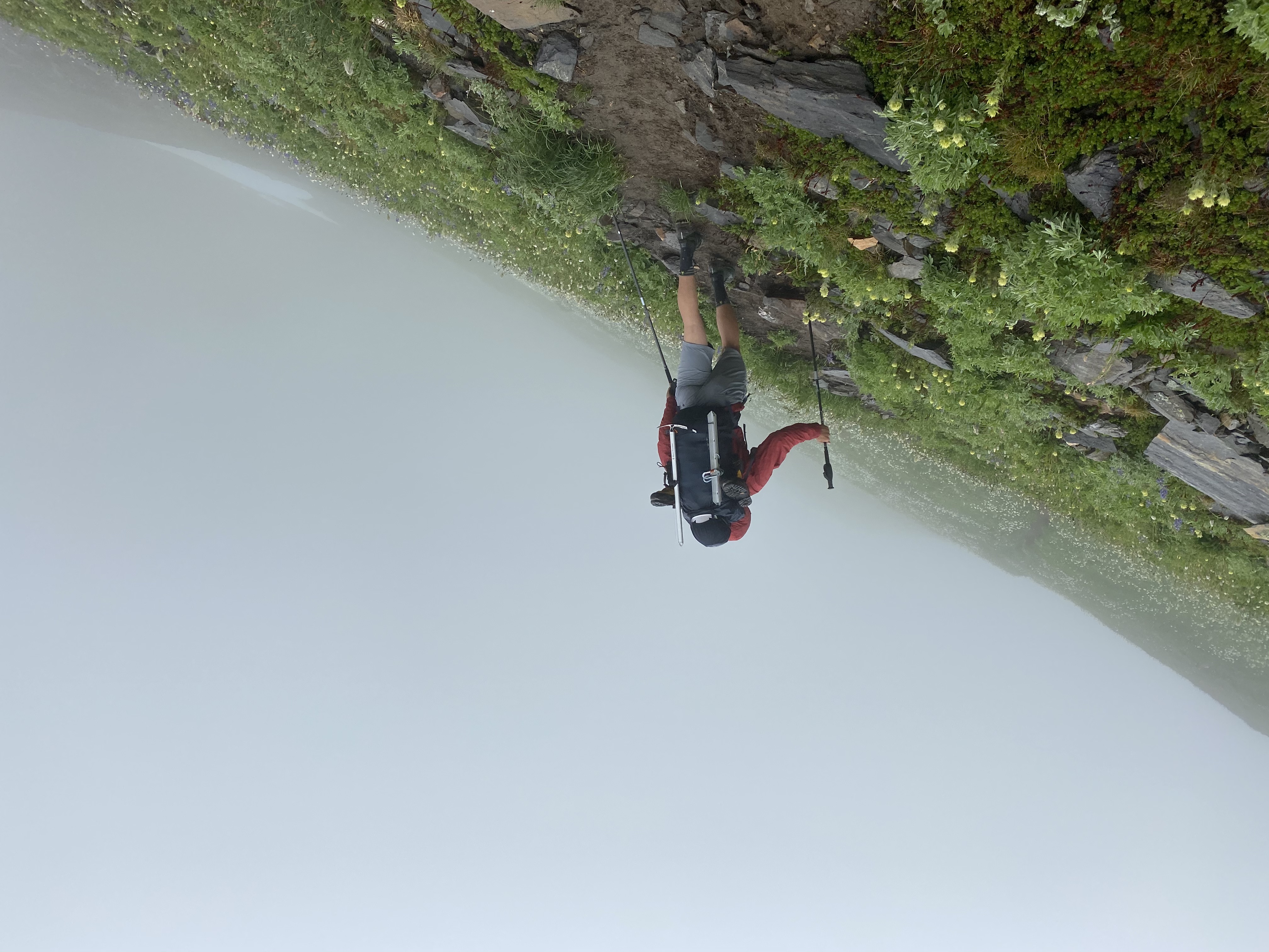 Yoshio traversing along a slope in the rain.