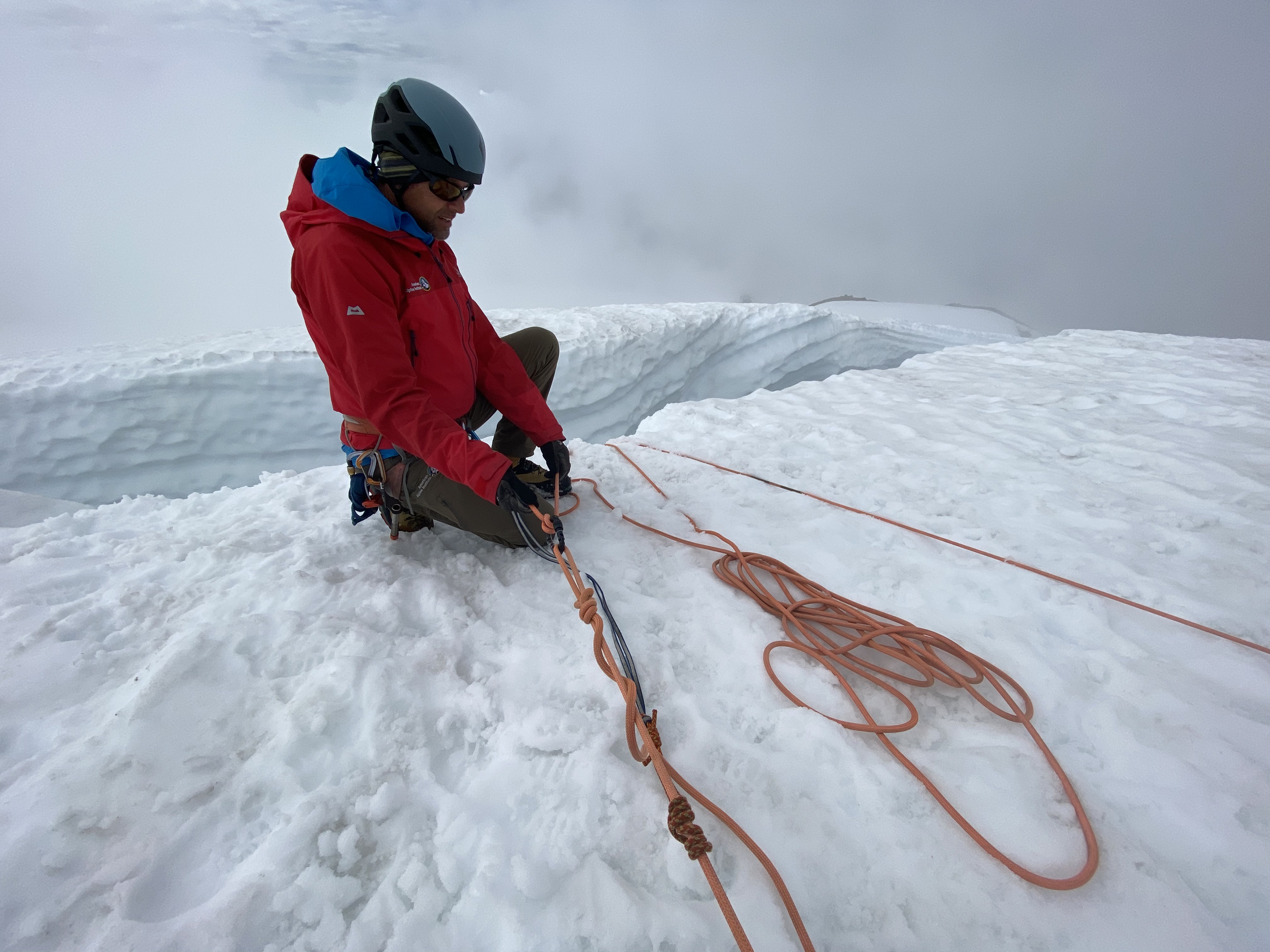 Paul lowering Kyle into a crevasse with a Munter hitch.