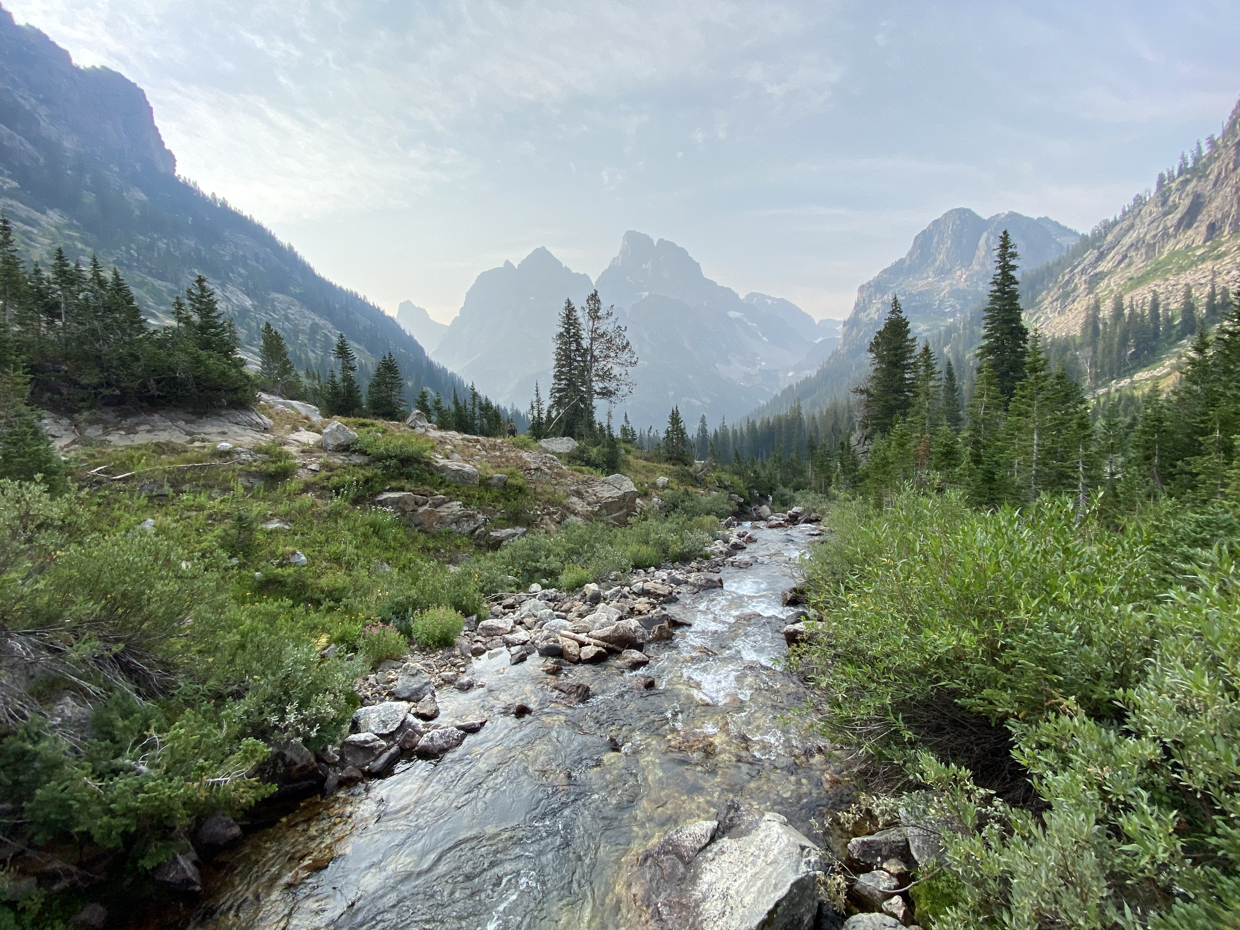 A view of Cascade Creek and the Grand Teton in the background.