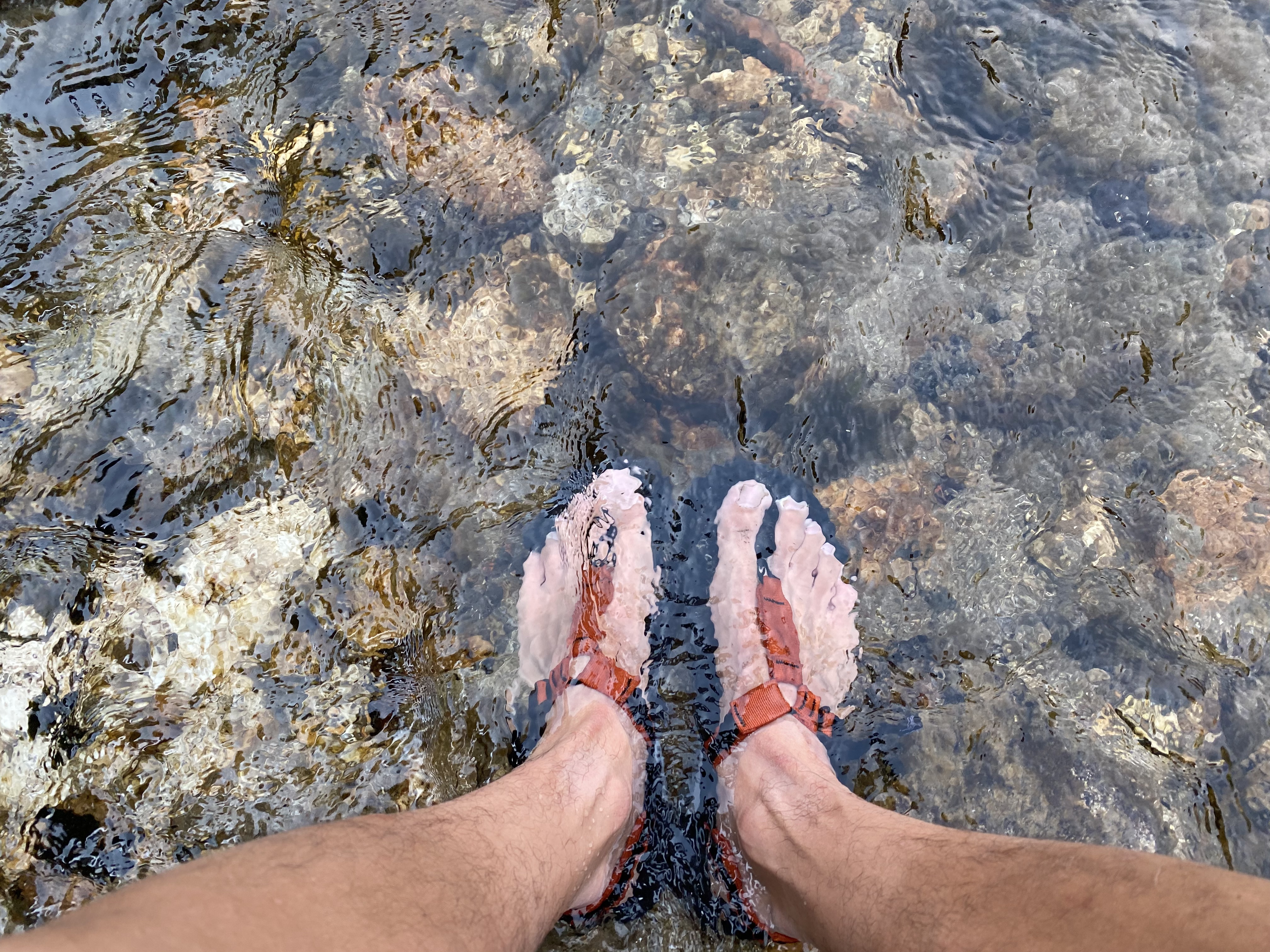 Yoshio dipping his feet in the South Fork Cascade Canyon Creek.